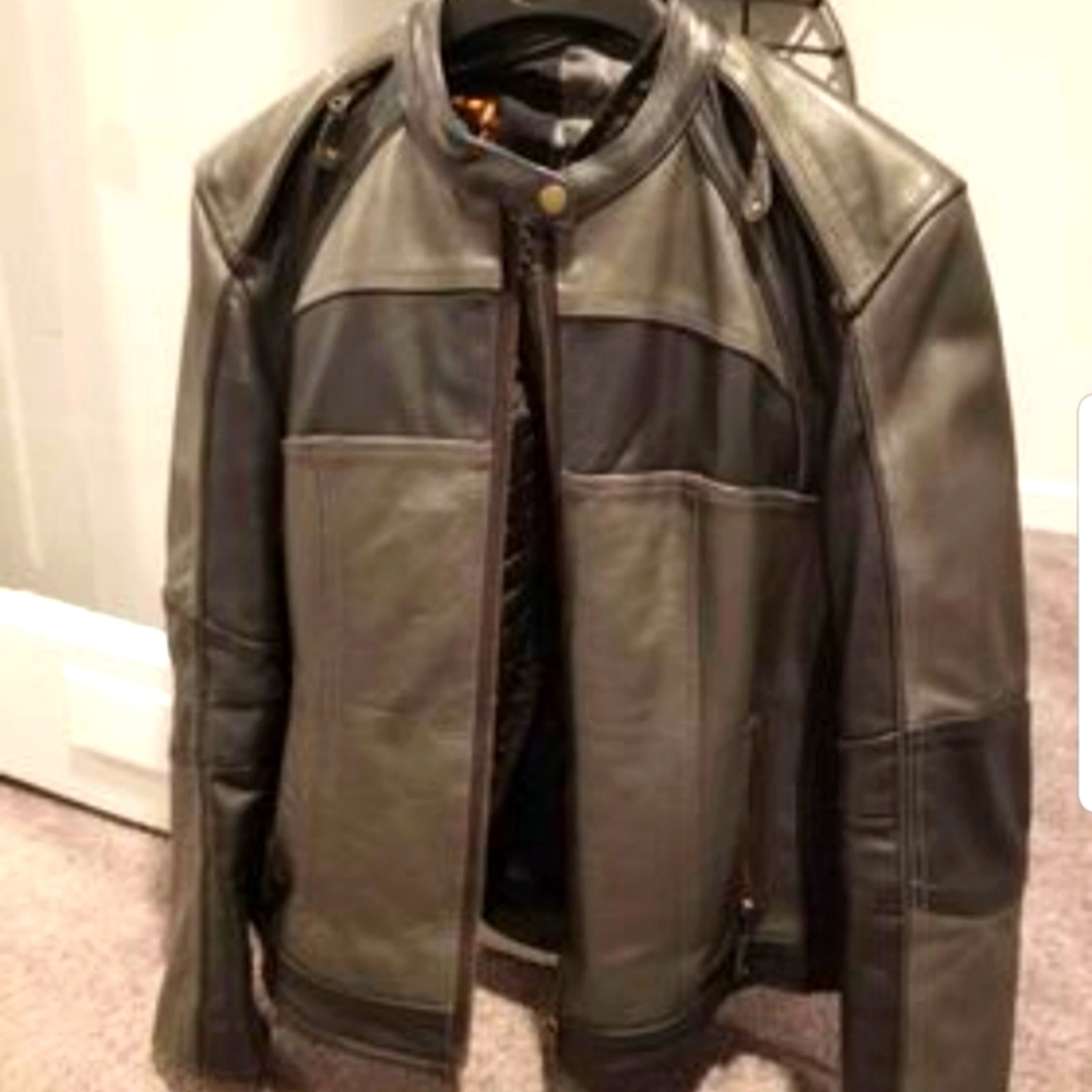 Women's motorcycle jacket, size Medium. Only worn once, in excellent condition.